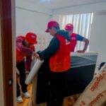 a group of men in red uniforms